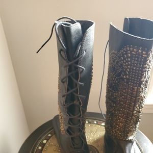 Black leather moccasin boots with studs